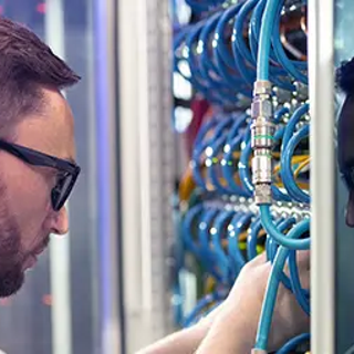 A truit technician assessing servers on site.